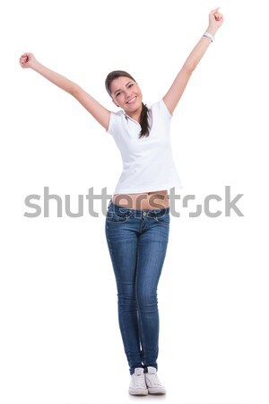 beautiful brunette woman in white t-shirt stepping and celebrati Stock photo © feedough