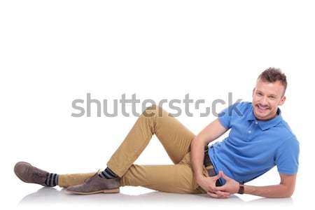 man lying down and holds the back of his neck Stock photo © feedough