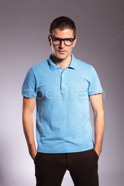 casual man looks at you with both hands in pockets Stock photo © feedough