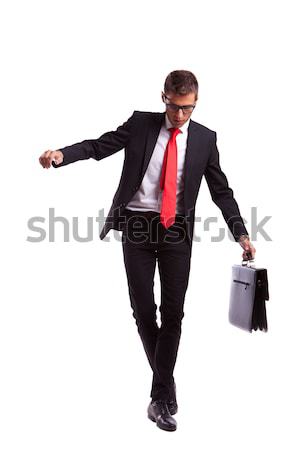 Business man balancing and walking forward Stock photo © feedough