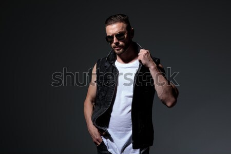 seuctive man with sunglasses poses while looking to side Stock photo © feedough