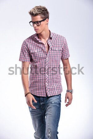 man sitting on chair holds the back of his head Stock photo © feedough