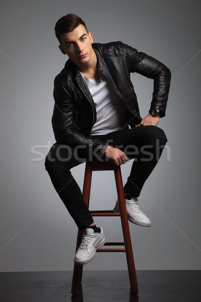 male model in leather jacket posing seated while resting  Stock photo © feedough