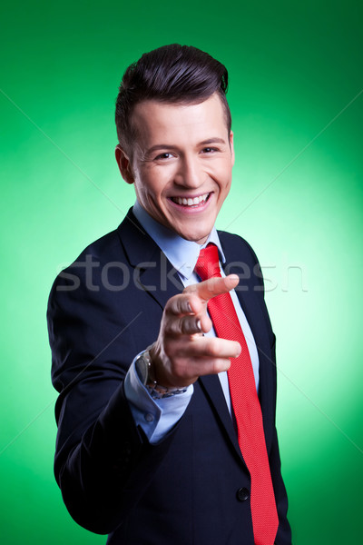 Giovani uomo d'affari punti dito sorridere bello Foto d'archivio © feedough