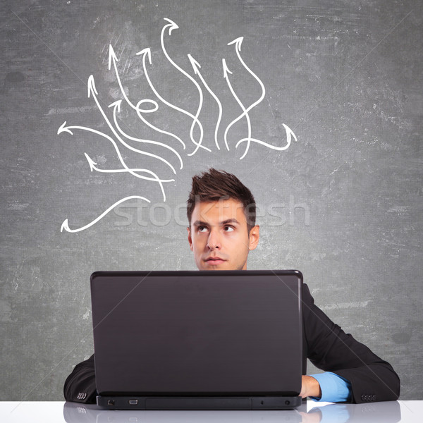 business man using laptop thinking Stock photo © feedough