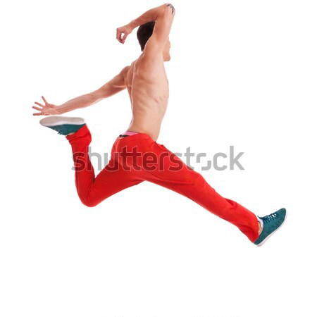 Fiatalember pózol magasugrás tánc mozgás kép Stock fotó © feedough