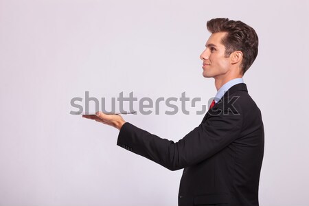 side view of man holding tablet Stock photo © feedough