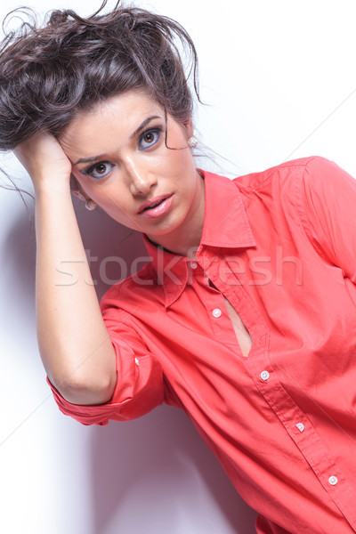 casual young woman with hand in hair Stock photo © feedough