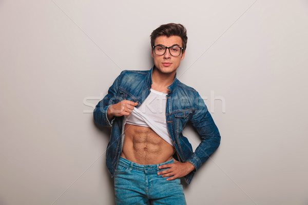 cool young man showing his abs  Stock photo © feedough