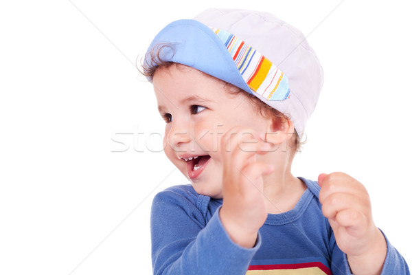 young child looking to the side and smiling Stock photo © feedough