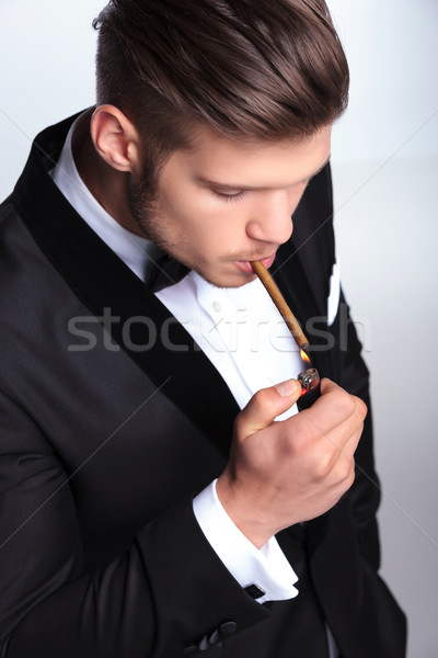 business man lighting his cigar up Stock photo © feedough