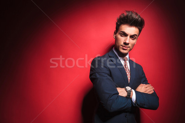 frowning businessman with red tie and hands crossed  Stock photo © feedough