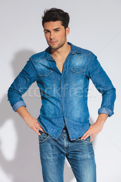 confident casual man standing with hands on hips Stock photo © feedough