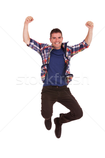 Giovani felice uomo jumping aria foto Foto d'archivio © feedough