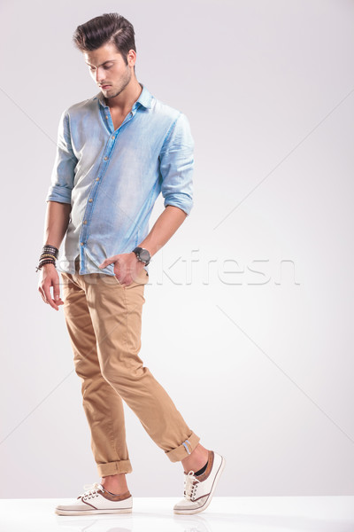  young casual man walking with his hand in pocket  Stock photo © feedough