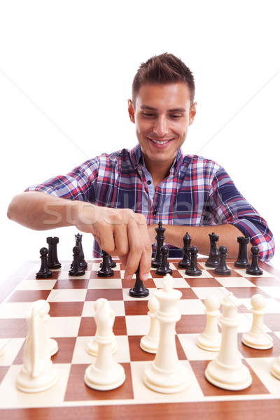 молодые случайный человека играет шахматам счастливым Сток-фото © feedough