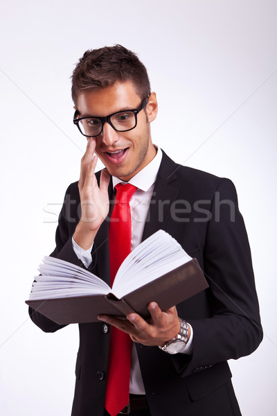 business man being excited by the book Stock photo © feedough
