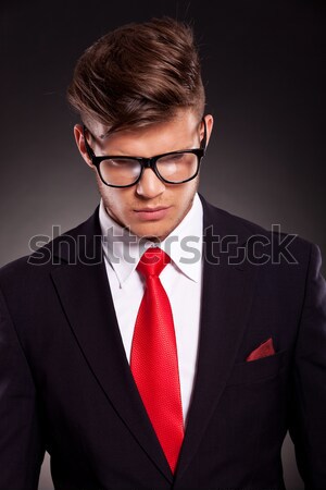 6817806 stock photo model in black suit and red tie posing