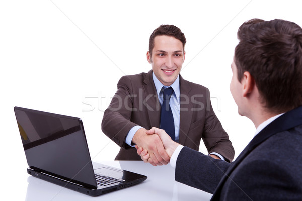  business men reaching to an agreement  Stock photo © feedough