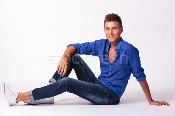 sitting relaxed on floor & smiling Stock photo © feedough