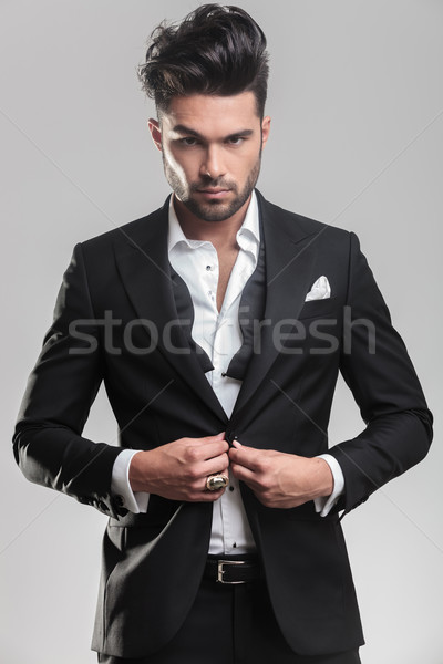 Portrait of an elegant young man looking at the camera Stock photo © feedough