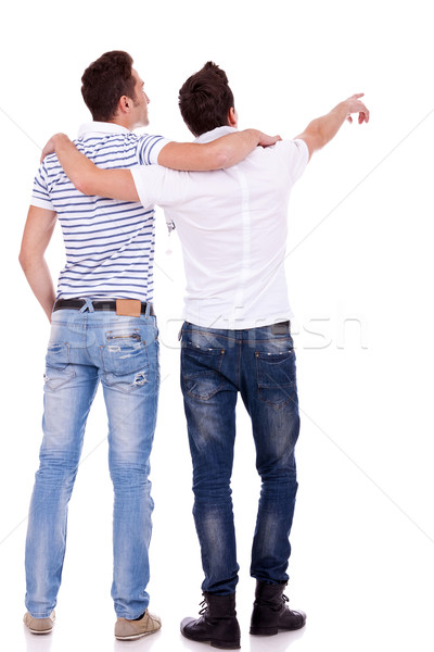 two young men pointing at somethin Stock photo © feedough