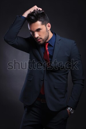 business man with hand in pocket and in hair Stock photo © feedough