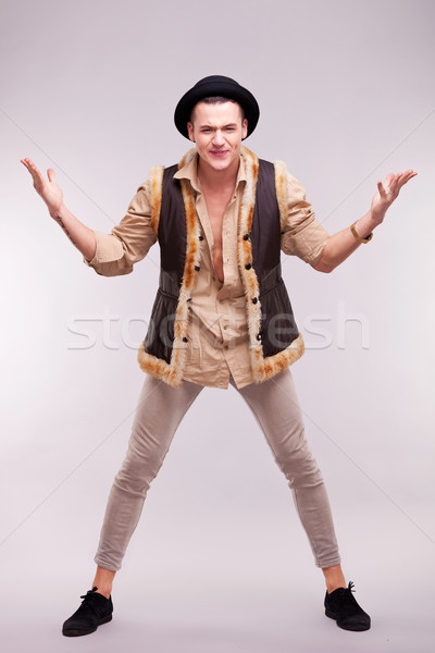 Férfi visel szőrmebunda kalap vicces fiatalember Stock fotó © feedough