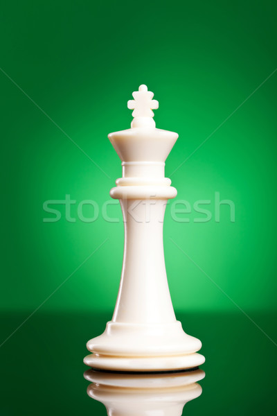 Stock photo: white king on green background