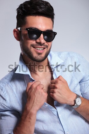 casual man with fingers on his chin Stock photo © feedough
