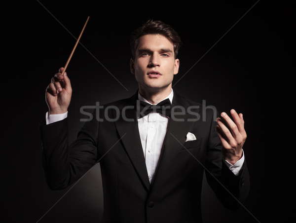 Handsome young man holding a stick in his hand Stock photo © feedough