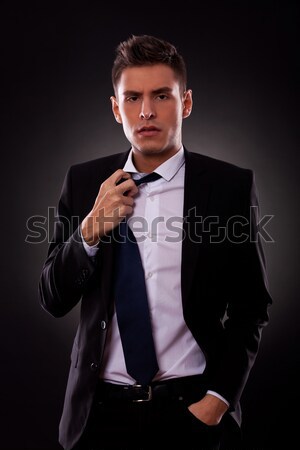 A Young businessman loosing his tie Stock photo © feedough