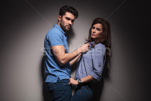  fashion man pulling his girlfriend towards him  Stock photo © feedough