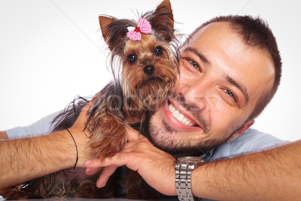 man is holding his pet yorkshire terrier puppy dog  Stock photo © feedough