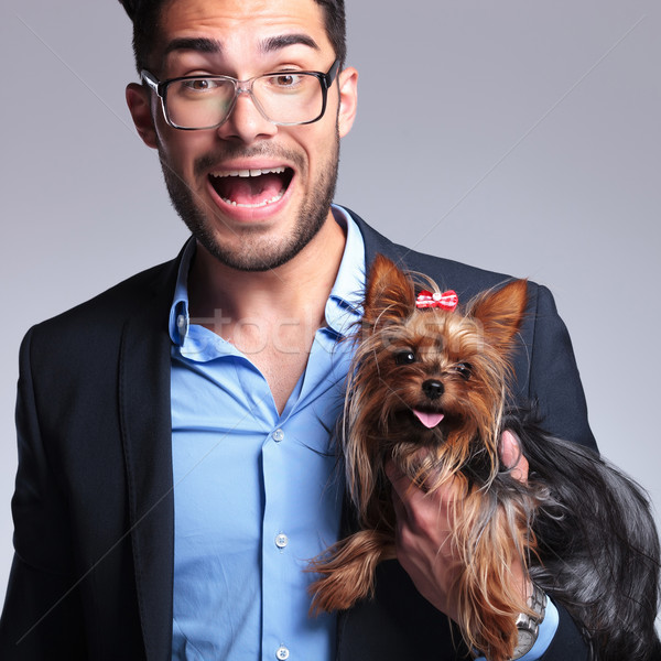surprised young man holds puppy Stock photo © feedough