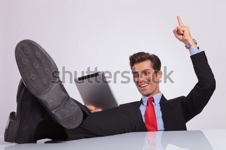 business man reads with feet on desk Stock photo © feedough