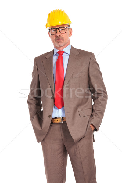 relaxed senior construction engineer standing with hands in pock Stock photo © feedough