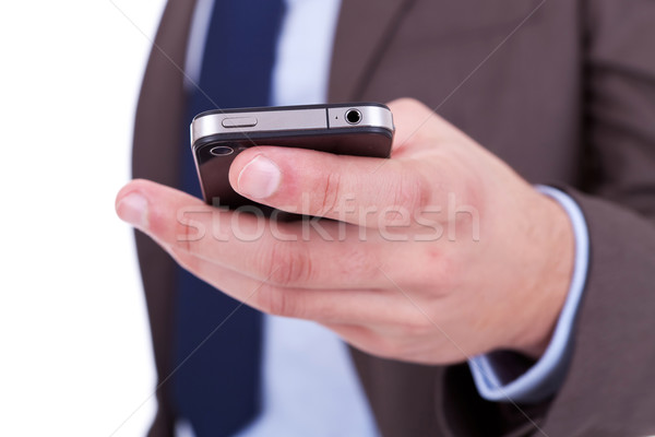 Flat cell phone in businessman hand Stock photo © feedough