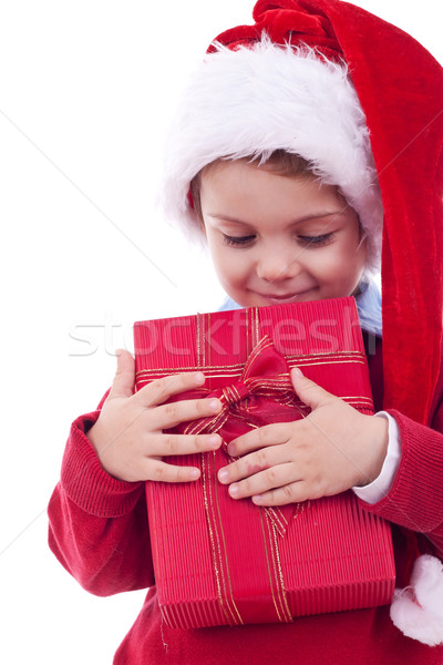 Boy holding a christmas gift Stock photo © feedough