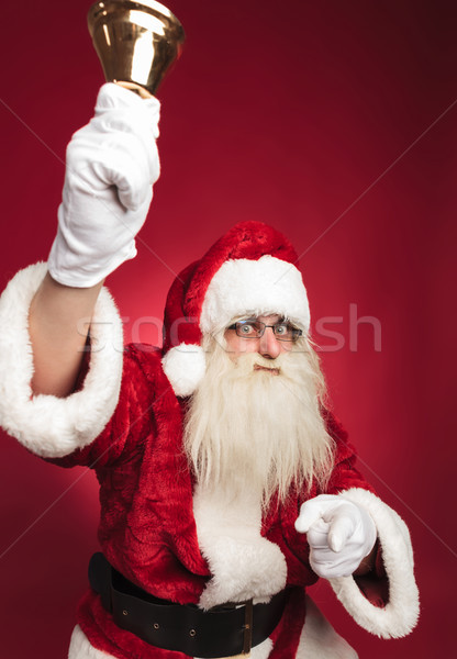 santa claus ringing bell and pointing finger Stock photo © feedough