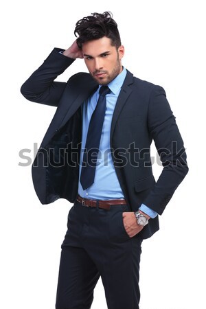 fashion business man passing his hand through his hair Stock photo © feedough