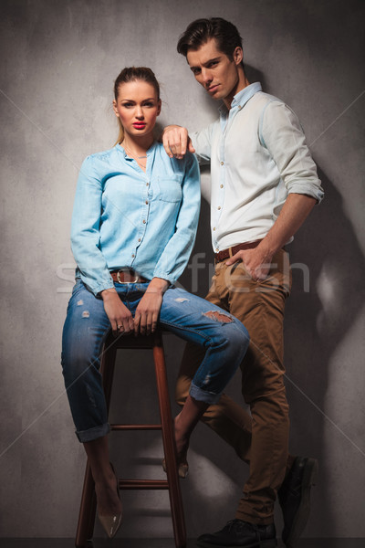 standing casual man is leaning elbow on seated girlfriend  Stock photo © feedough