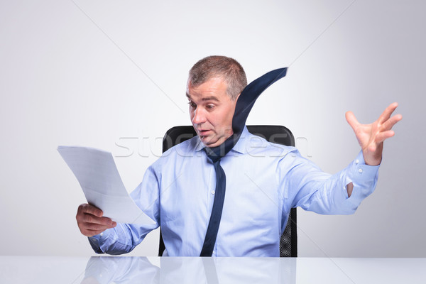 old business man blown off by documents Stock photo © feedough