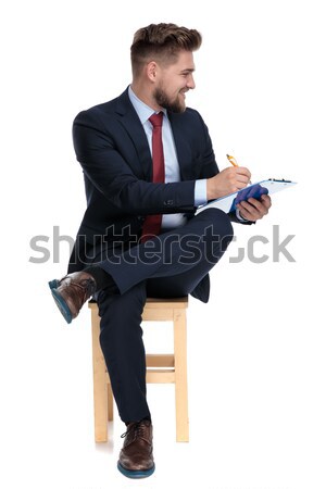 сидящий молодые деловой человек стороны бедро Сток-фото © feedough