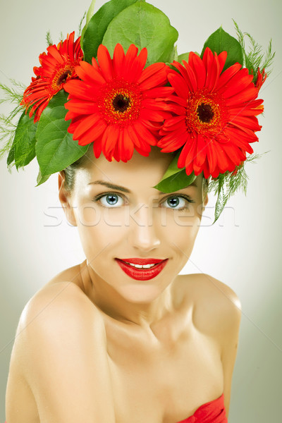 gracefull young woman with red gerbera flowers in her hair Stock photo © feedough