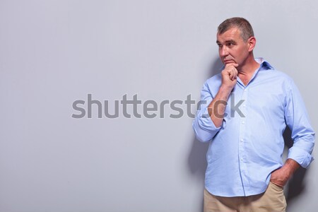 casual old man pondering Stock photo © feedough