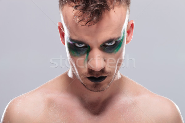 casual man with makeup looks at you emotionless Stock photo © feedough