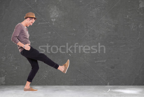 young man kicking and smiling Stock photo © feedough