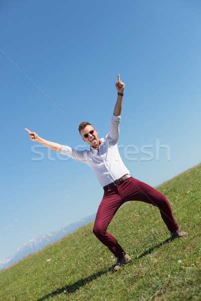 outdoor casual man cheers and shouts Stock photo © feedough