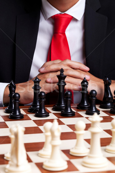 Business man standing in front of unstarted chess game Stock photo © feedough